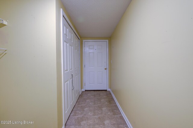 6813 Casey Pl, Louisville, KY 40229 - hallway featuring baseboards and a textured ceiling