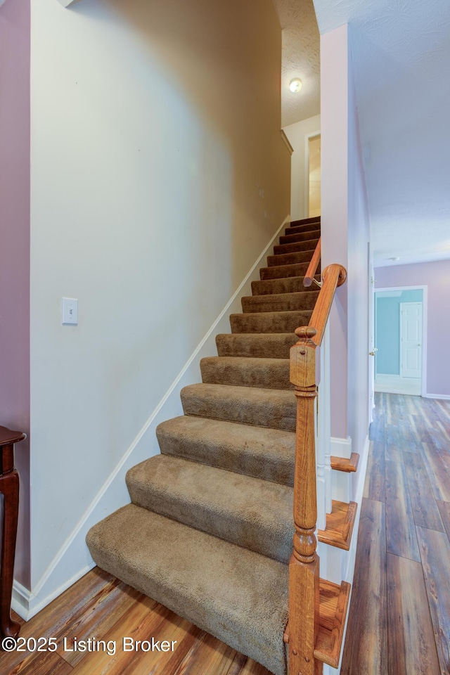 6813 Casey Pl, Louisville, KY 40229 - staircase featuring wood finished floors