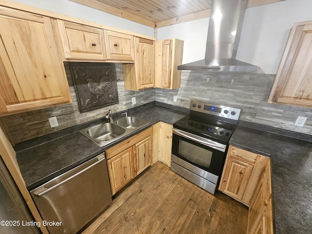 409 Woodhaven Ln, Leitchfield, KY 42754 - kitchen featuring wall chimney range hood, appliances with stainless steel finishes, light brown cabinets, dark countertops, and tasteful backsplash