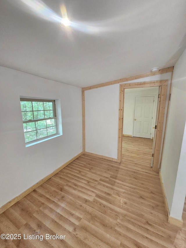 409 Woodhaven Ln, Leitchfield, KY 42754 - empty room with light wood-style floors and a smoke detector