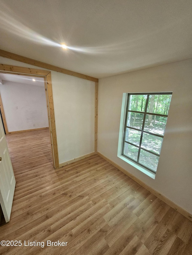 409 Woodhaven Ln, Leitchfield, KY 42754 - spare room with light wood-style floors and baseboards