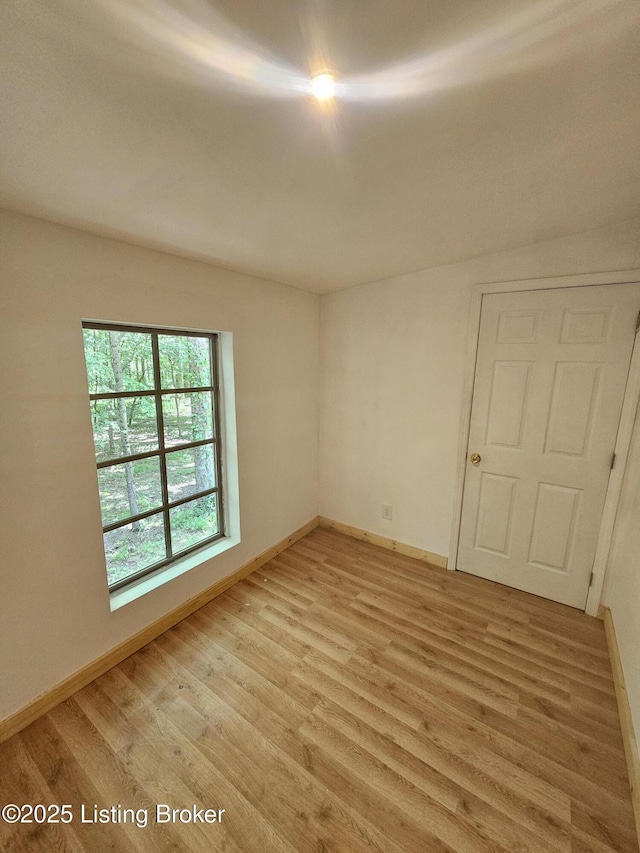 409 Woodhaven Ln, Leitchfield, KY 42754 - unfurnished room featuring light wood-style floors and baseboards
