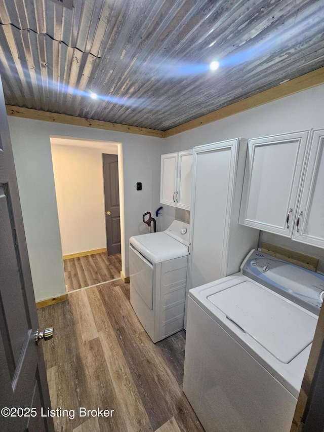409 Woodhaven Ln, Leitchfield, KY 42754 - laundry room with cabinet space, dark wood-type flooring, washer and dryer, and wood ceiling