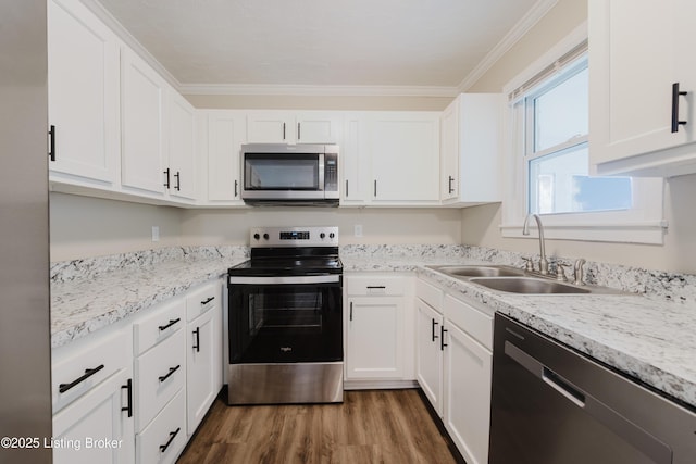 5105 Kilmer Blvd, Louisville, KY 40213 - kitchen with stainless steel appliances, dark wood finished floors, white cabinets, light countertops, and crown molding