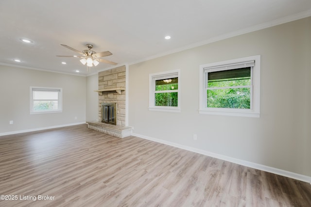 5105 Kilmer Blvd, Louisville, KY 40213 - unfurnished living room featuring crown molding, wood finished floors, ceiling fan, a stone fireplace, and recessed lighting