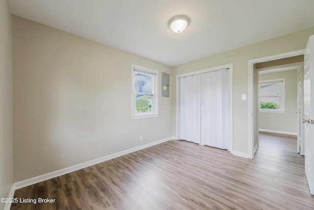 5105 Kilmer Blvd, Louisville, KY 40213 - unfurnished bedroom with wood finished floors, a closet, and electric panel