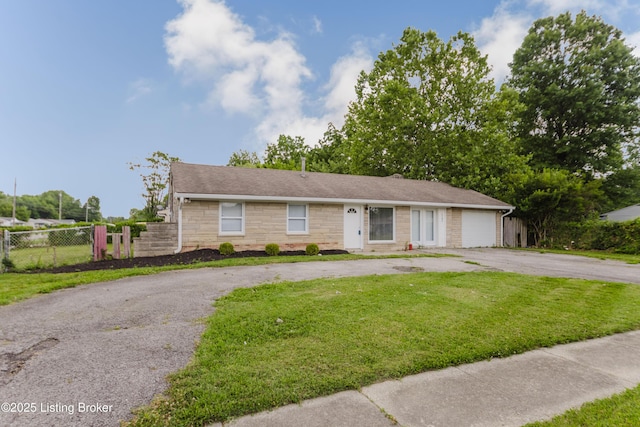 5105 Kilmer Blvd, Louisville, KY 40213 - single story home with asphalt driveway, an attached garage, and stone siding