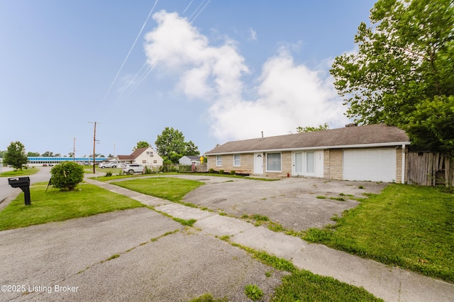 5105 Kilmer Blvd, Louisville, KY 40213 - ranch-style house with an attached garage and asphalt driveway