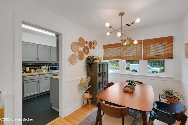 312 Norbourne Blvd, Louisville, KY 40207 - dining room featuring a chandelier and wood finished floors