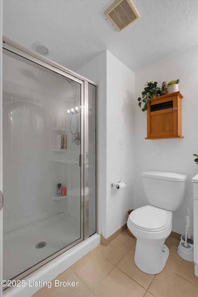 312 Norbourne Blvd, Louisville, KY 40207 - full bathroom with a shower stall, tile patterned floors, and a textured ceiling