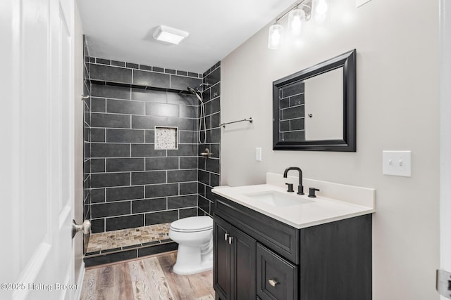 9006 Big Boulder Dr, Louisville, KY 40291 - full bath featuring vanity, a tile shower, and wood finished floors