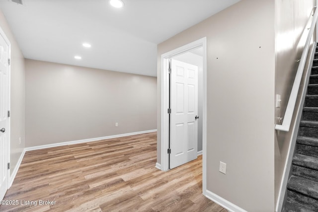 9006 Big Boulder Dr, Louisville, KY 40291 - basement featuring stairway, recessed lighting, and light wood-type flooring