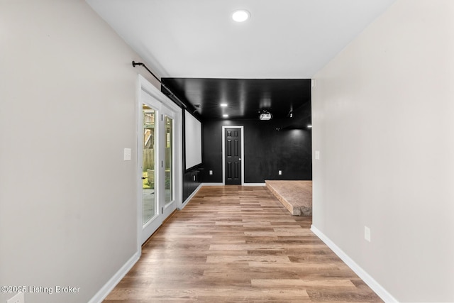 9006 Big Boulder Dr, Louisville, KY 40291 - hallway with light wood finished floors, recessed lighting, and a barn door