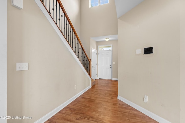 9006 Big Boulder Dr, Louisville, KY 40291 - foyer with stairs, wood finished floors, and a towering ceiling