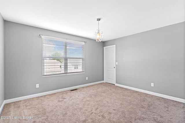 9006 Big Boulder Dr, Louisville, KY 40291 - carpeted spare room featuring baseboards and a chandelier