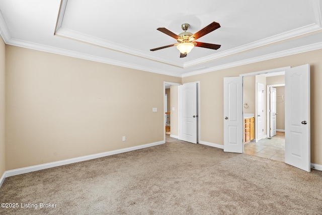 9006 Big Boulder Dr, Louisville, KY 40291 - unfurnished bedroom featuring light colored carpet, a tray ceiling, crown molding, a ceiling fan, and connected bathroom