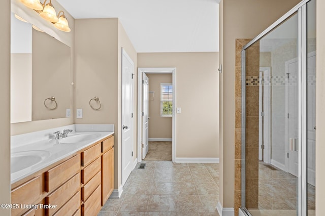 9006 Big Boulder Dr, Louisville, KY 40291 - bathroom featuring double vanity, a shower stall, and tile patterned floors