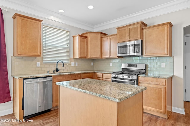 9006 Big Boulder Dr, Louisville, KY 40291 - kitchen with appliances with stainless steel finishes, light wood finished floors, a kitchen island, crown molding, and light stone counters