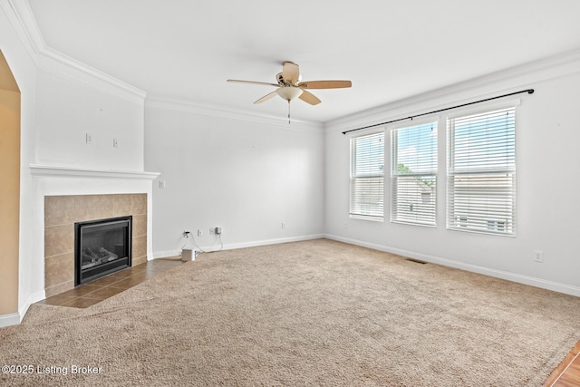 9006 Big Boulder Dr, Louisville, KY 40291 - unfurnished living room with ceiling fan, crown molding, a tile fireplace, and carpet floors