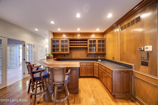 7202 Doe Crest Ct, Prospect, KY 40059 - indoor wet bar with light wood finished floors, range hood, and recessed lighting