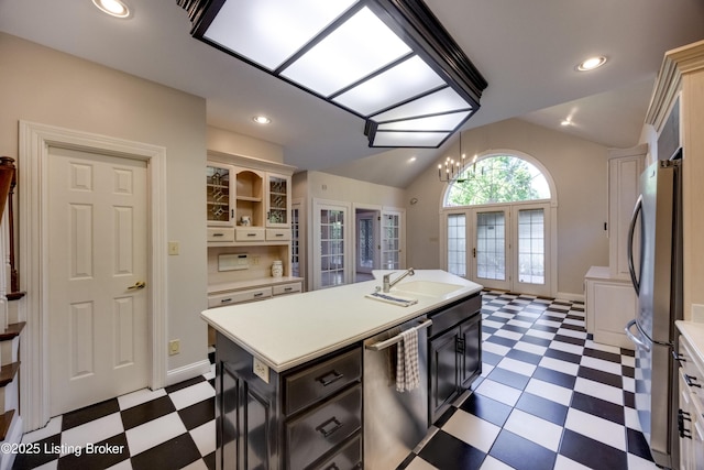 7202 Doe Crest Ct, Prospect, KY 40059 - kitchen featuring tile patterned floors, appliances with stainless steel finishes, light countertops, vaulted ceiling, and french doors