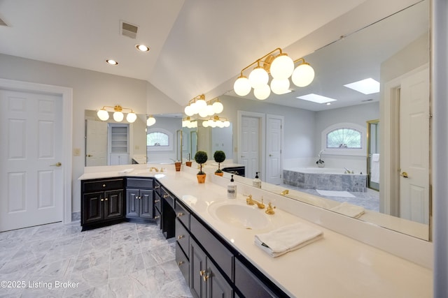 7202 Doe Crest Ct, Prospect, KY 40059 - full bath featuring double vanity, a garden tub, a chandelier, a skylight, and recessed lighting