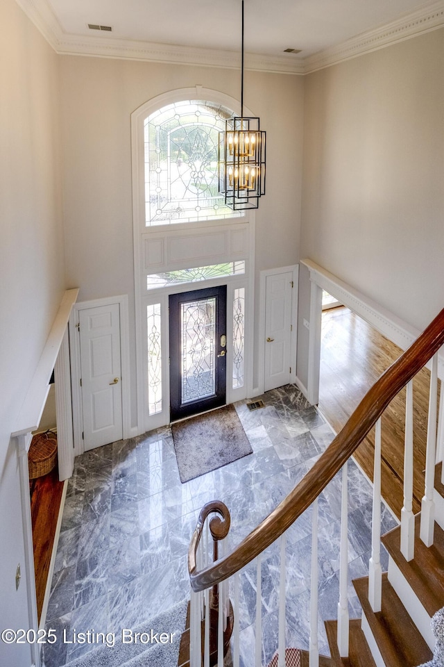 7202 Doe Crest Ct, Prospect, KY 40059 - entrance foyer with a chandelier, a towering ceiling, marble finish flooring, stairway, and ornamental molding