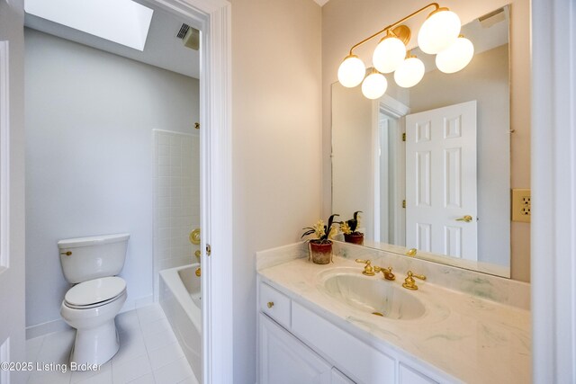 7202 Doe Crest Ct, Prospect, KY 40059 - bathroom featuring a skylight, vanity, and tile patterned flooring