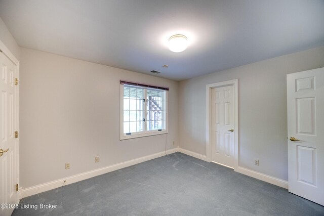 7202 Doe Crest Ct, Prospect, KY 40059 - unfurnished bedroom with baseboards and dark carpet