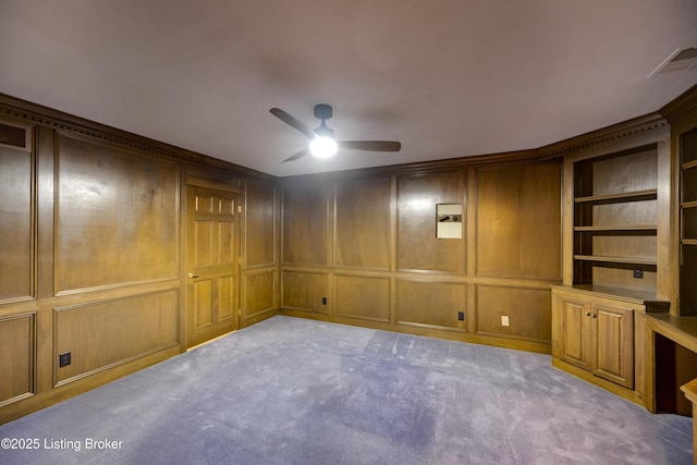 7202 Doe Crest Ct, Prospect, KY 40059 - empty room featuring a ceiling fan, light carpet, a decorative wall, and built in shelves