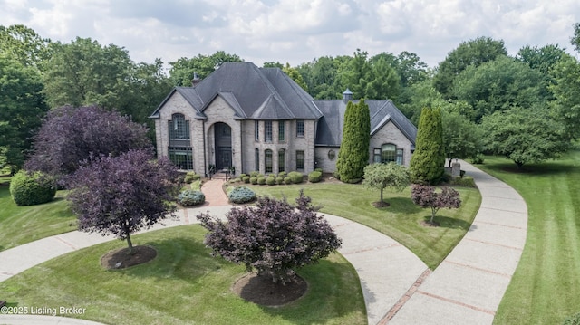 7202 Doe Crest Ct, Prospect, KY 40059 - french country inspired facade featuring a front yard, stone siding, and brick siding