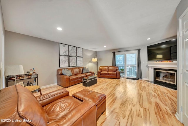 5503 Forest Lake Dr, Prospect, KY 40059 - living area featuring a fireplace with flush hearth, wood finished floors, and recessed lighting