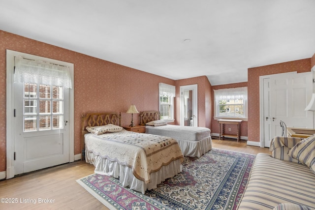 2628 Landor Ave, Louisville, KY 40205 - bedroom featuring wallpapered walls and light wood-style floors
