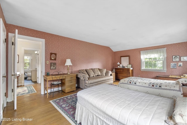 2628 Landor Ave, Louisville, KY 40205 - bedroom with wallpapered walls, wood finished floors, and multiple windows
