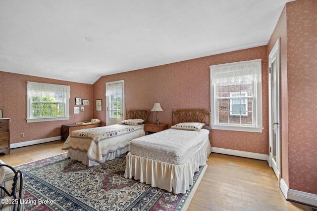 2628 Landor Ave, Louisville, KY 40205 - bedroom featuring hardwood / wood-style floors, wallpapered walls, and lofted ceiling