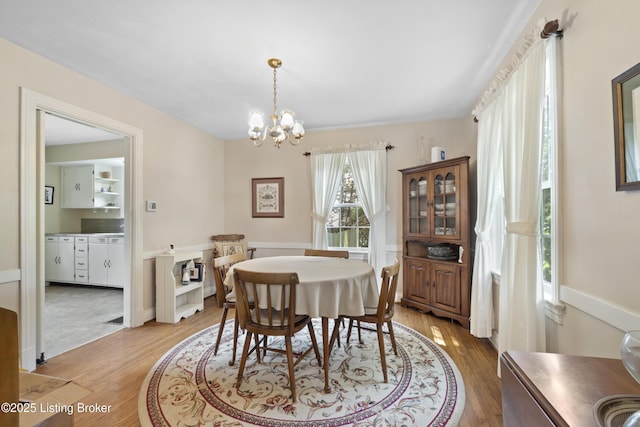 2628 Landor Ave, Louisville, KY 40205 - dining area featuring a chandelier and light wood-style floors