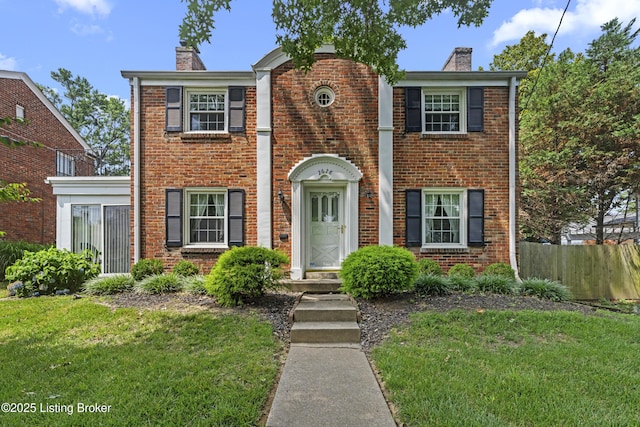 2628 Landor Ave, Louisville, KY 40205 - view of front of house with a chimney and brick siding