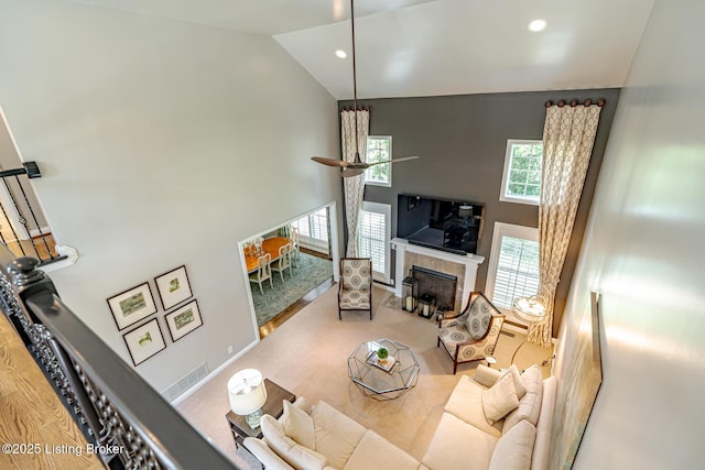 17503 Polo Run Ln, Louisville, KY 40245 - carpeted living room featuring high vaulted ceiling, a tile fireplace, recessed lighting, and a ceiling fan
