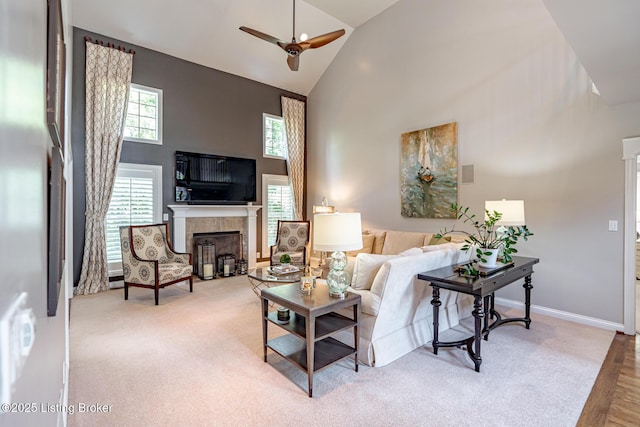 17503 Polo Run Ln, Louisville, KY 40245 - carpeted living room with high vaulted ceiling, a ceiling fan, healthy amount of natural light, a glass covered fireplace, and wood finished floors