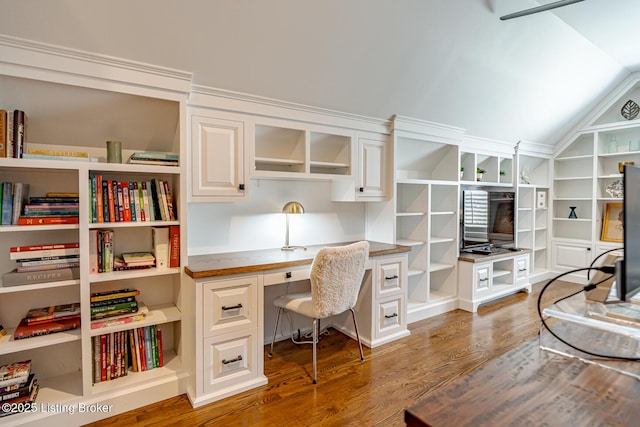 17503 Polo Run Ln, Louisville, KY 40245 - office featuring wood finished floors, vaulted ceiling, built in desk, and built in shelves