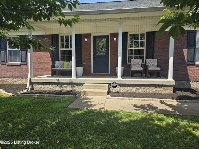 306 Butler Dr, Bardstown, KY 40004 - view of exterior entry featuring a porch, brick siding, and a shingled roof