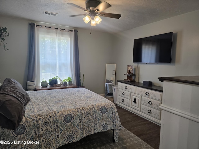 306 Butler Dr, Bardstown, KY 40004 - bedroom featuring dark wood-style floors, a textured ceiling, and a ceiling fan