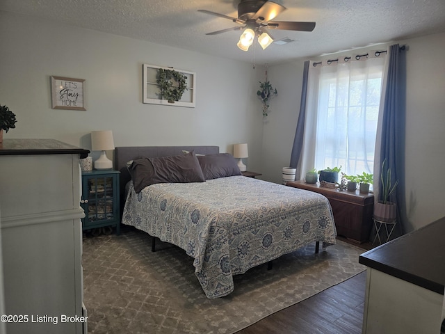 306 Butler Dr, Bardstown, KY 40004 - bedroom with dark wood-style floors, a textured ceiling, and a ceiling fan