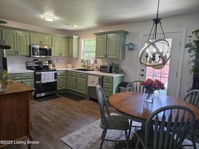 306 Butler Dr, Bardstown, KY 40004 - kitchen with green cabinetry, appliances with stainless steel finishes, a chandelier, a textured ceiling, and dark wood finished floors