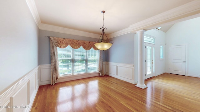 5407 Merribrook Ln, Prospect, KY 40059 - empty room featuring decorative columns, healthy amount of natural light, a decorative wall, wainscoting, and light wood-style flooring