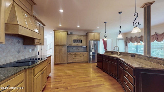 5407 Merribrook Ln, Prospect, KY 40059 - kitchen featuring custom range hood, stainless steel refrigerator with ice dispenser, light wood-type flooring, black electric stovetop, and decorative backsplash
