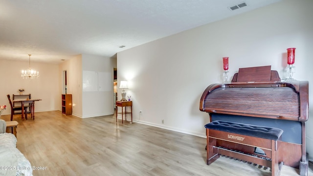 3030 Breckenridge Ln Apt 201, Louisville, KY 40220 - living room featuring a chandelier and wood finished floors