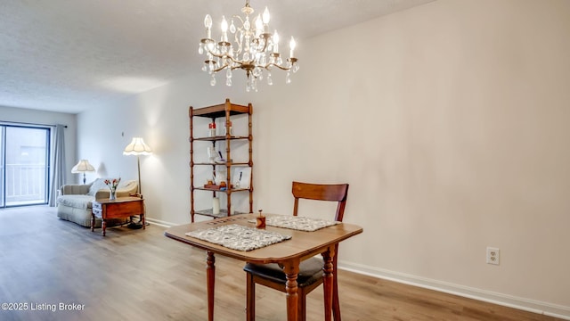 3030 Breckenridge Ln Apt 201, Louisville, KY 40220 - living area with wood finished floors and a chandelier