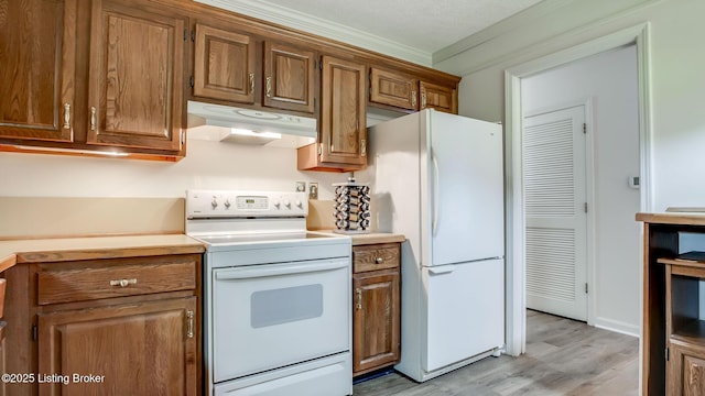 3030 Breckenridge Ln Apt 201, Louisville, KY 40220 - kitchen with white appliances, under cabinet range hood, light wood-style floors, and brown cabinets