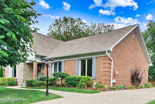 509 Oak Branch Rd, Louisville, KY 40245 - view of front of home featuring a shingled roof, brick siding, and a front yard